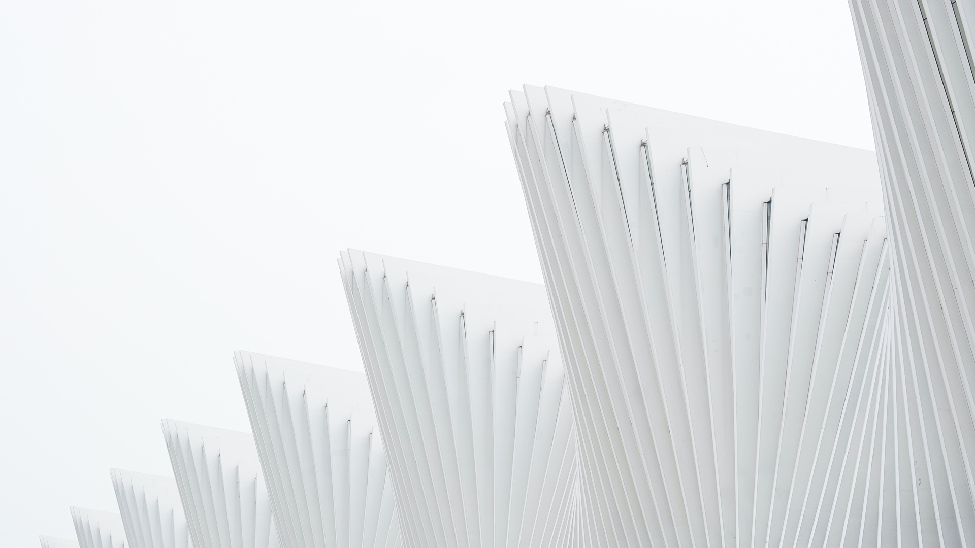 Contemporary white architecture against a clear sky